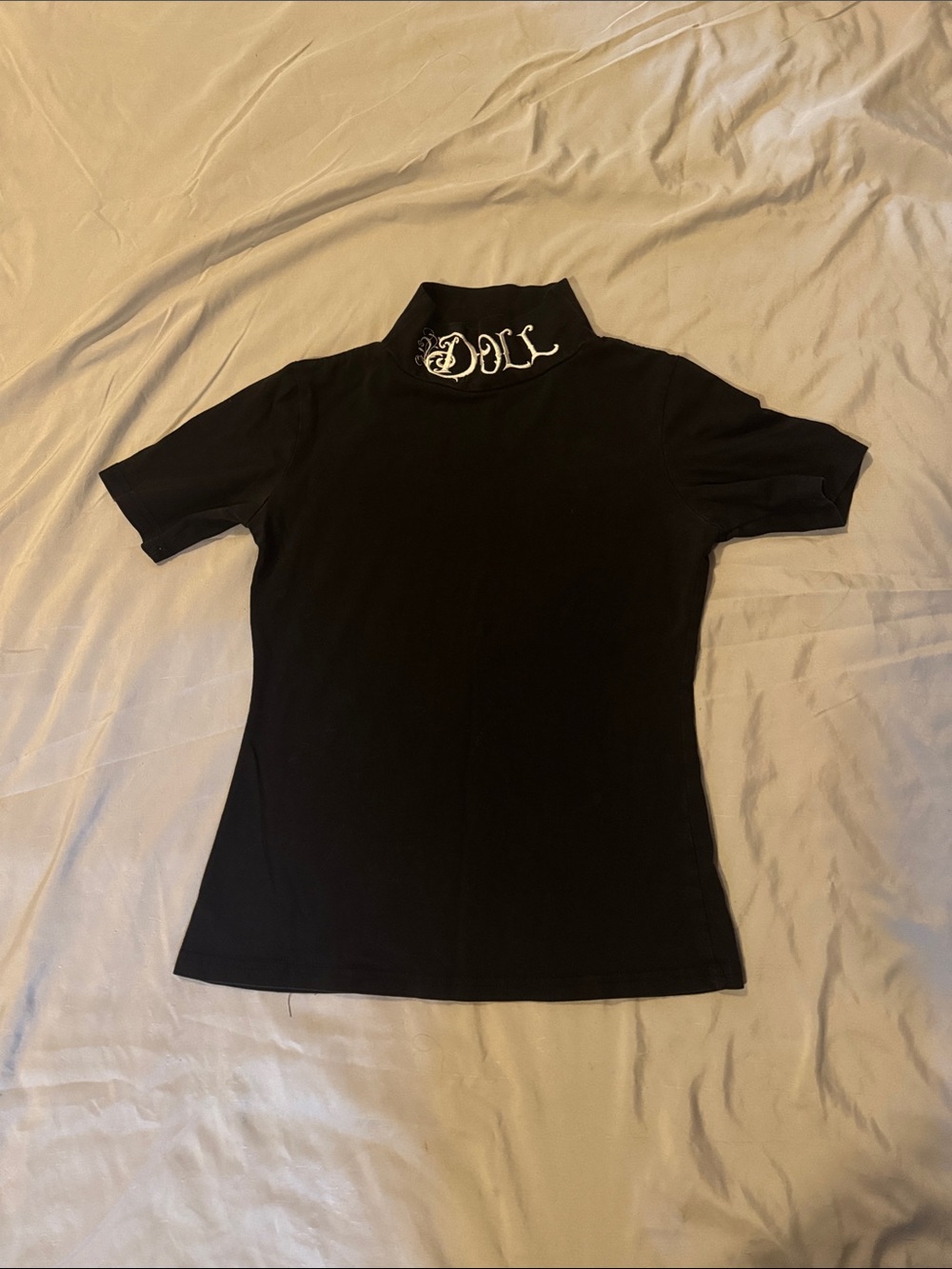Widow Black Short-Sleeve Turtleneck Top with Embroidered Doll Neck Detail